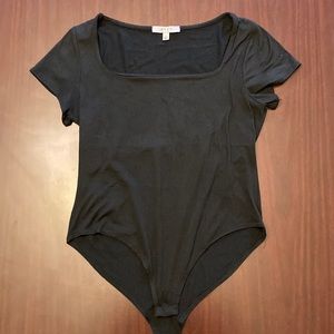 Gaze, large, black short sleeve square neck body suit.